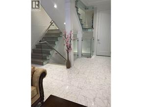 Vancouver apartment for rent - A living room with a marble floor and a glass staircase.