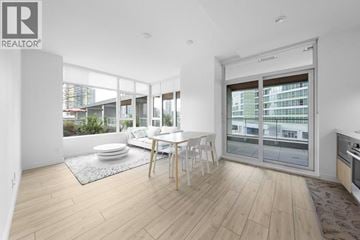 Burnaby apartment for rent - A modern living room with a dining table and chairs.