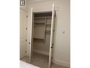 Richmond apartment for rent - A white door is open to a small closet.