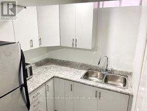 Mississauga (East Credit) apartment for rent - A kitchen with a sink and a refrigerator.