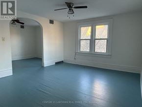 Prince Edward County (Picton Ward) multi-family for rent - A room with a ceiling fan and a window.