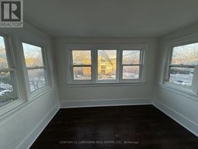 Prince Edward County (Picton Ward) multi-family for rent - A room with a window showing a view of a building outside.
