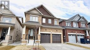 Springwater (Midhurst) apartment for rent - A row of houses with garages and driveways.