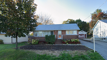 Belleville apartment for rent - A house with a front yard and a tree.
