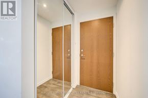 Vaughan (Concord) condo for rent - A room with two wooden doors and a glass door.