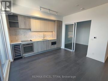 Toronto (Humewood-Cedarvale) condo for rent - A modern kitchen with RE/MAX EXCEL TITAN, Brokerage logo.