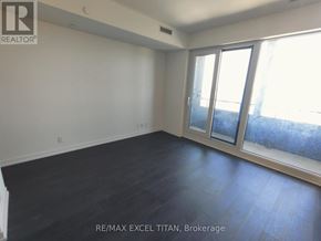 Toronto (Humewood-Cedarvale) condo for rent - A room with RE/MAX EXCEL TITAN logo on the wall.