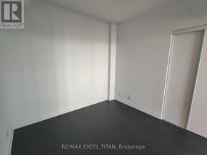 Toronto (Humewood-Cedarvale) condo for rent - A room with a black floor and white walls, with a door on the right side.