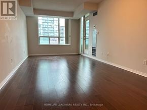 Toronto (Willowdale East) condo for rent - A room with wooden flooring and a large window.