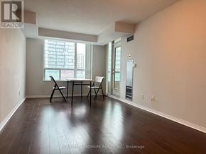 Toronto (Willowdale East) condo for rent - A room with a table and chairs in front of a window.
