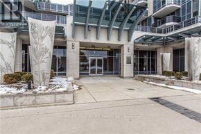 Toronto (Newtonbrook East) condo for rent - The entrance to a building with a glass roof and a sign that reads "B".
