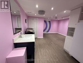 Ajax (Northeast Ajax) apartment for rent - A bathroom with a sink, mirror, and toilet.