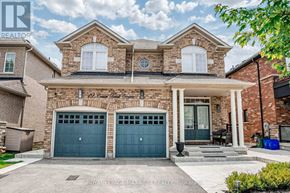 Vaughan (Vellore Village) apartment for rent - A two-story house with a brick facade and two garage doors.