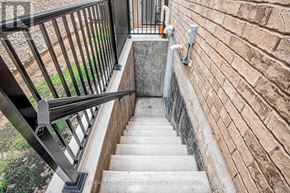Vaughan (Vellore Village) apartment for rent - A set of stairs with a metal railing and a brick wall on one side.