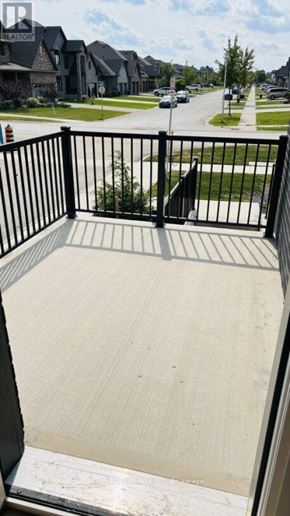 London South (South V) townhouse for rent - A balcony with a black railing and a concrete floor.