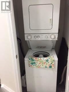 Markham (Cornell) apartment for rent - A white washing machine with a floral towel hanging on the door.