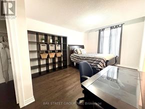 Innisfil (Lefroy) apartment for rent - A bedroom with a bed, a chair, and a desk.