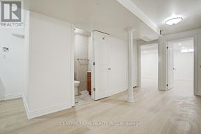 Markham (Middlefield) apartment for rent - A white bathroom with a toilet and a sink.