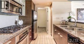 Vancouver apartment for rent - A kitchen with granite countertops and stainless steel appliances.