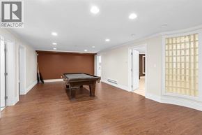 Vancouver apartment for rent - A room with a brown wall and a pool table.