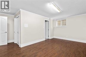 Vancouver apartment for rent - A room with wood flooring and white walls.
