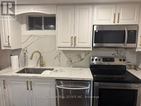 Newmarket (Bristol-London) apartment for rent - A kitchen with a stove, sink, and cabinets.