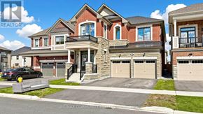Pickering apartment for rent - A large, multi-level house with a car parked in front.