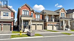 Pickering apartment for rent - A row of houses with the text RE/MAX Community Realty, Brokerage on the bottom.