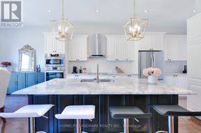 Newmarket (Glenway Estates) apartment for rent - A kitchen with a marble countertop and white cabinets.