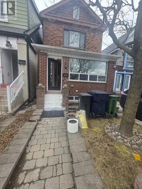 Toronto (Weston-Pellam Park) apartment for rent - A house with a sign that says RE/MAX on the front.