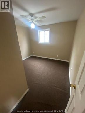 Windsor apartment for rent - A room with a ceiling fan and a window.
