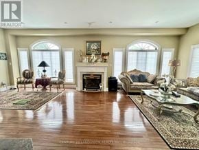 Aurora (Bayview Southeast) apartment for rent - A living room with a fireplace and a painting on the wall.
