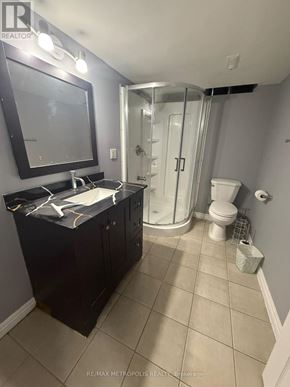 Markham (Middlefield) apartment for rent - A bathroom with a black cabinet and a white sink.