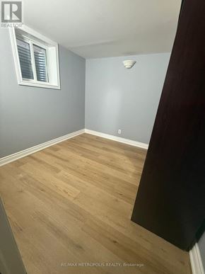 Markham (Middlefield) apartment for rent - A room with wooden flooring and a window with blinds.