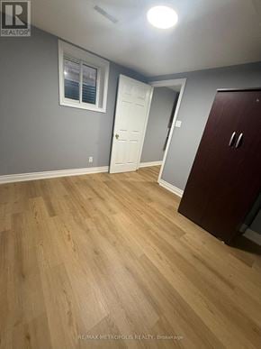 Markham (Middlefield) apartment for rent - A room with wooden flooring and a white door.