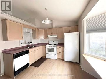 Niagara Falls (West Wood) apartment for rent - A kitchen with a white refrigerator, a white stove, and a white dishwasher.