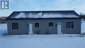 Hamilton multi-family for rent - A house with snow on the roof and ground.
