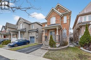 Ajax (Northwest Ajax) apartment for rent - A blue car is parked in front of a house with a sign that says "REALTOR".