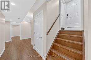 Ajax (Northwest Ajax) apartment for rent - A staircase with wooden steps and a white door on the side.