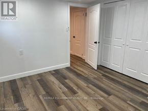 Hamilton (Raleigh) apartment for rent - A room with a wooden floor and white walls, with a doorway leading to another room.
