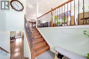 Windsor apartment for rent - A staircase with a wooden banister and a metal railing.