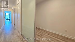 Toronto (Don Valley Village) condo for rent - A hallway with a door at the end and a sign that says REALTOR.