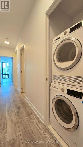Toronto (Don Valley Village) condo for rent - A row of washing machines are lined up against a wall.