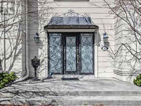 Toronto (St. Andrew-Windfields) apartment for rent - A house with a black door and a black lamp post.