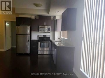 Markham (Wismer) condo for rent - A kitchen with a refrigerator, microwave, oven, and sink.