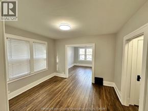 Windsor apartment for rent - A room with wooden floors and white walls.