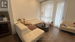 Richmond Hill (Oak Ridges) townhouse for rent - A living room with a white couch and a coffee table.