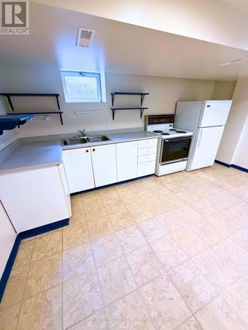 Toronto (Clanton Park) apartment for rent - A kitchen with white cabinets and appliances.