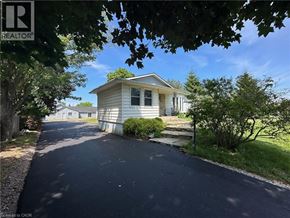 Stoney Creek apartment for rent - A residential area with a house and a driveway.