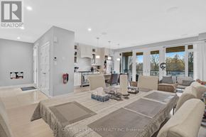 Ottawa apartment for rent - A spacious living room with a large couch and a coffee table.